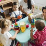 nursery-children-playing-with-teacher-in-the-classroom.jpg