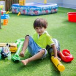 Boy with inflatable microphone at a children's birthday party.